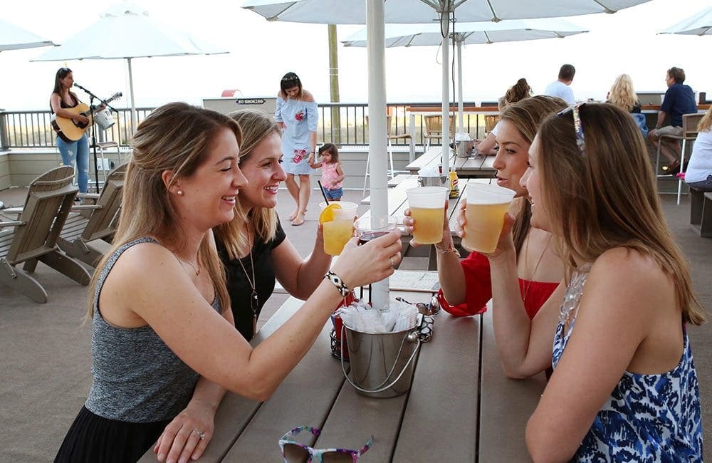 Women drinking at Harrys rooftop bar.