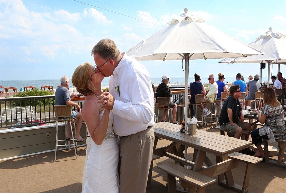 Couple kissing at wedding- harrys cape may
