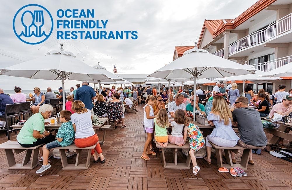 Outdoor image of people sitting at Harrys oceanfront restaurant