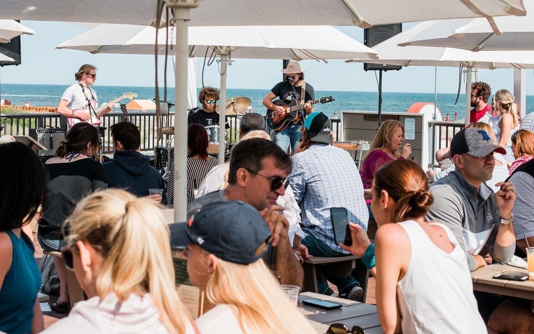 Harrys outdoor deck- live music with people sitting.